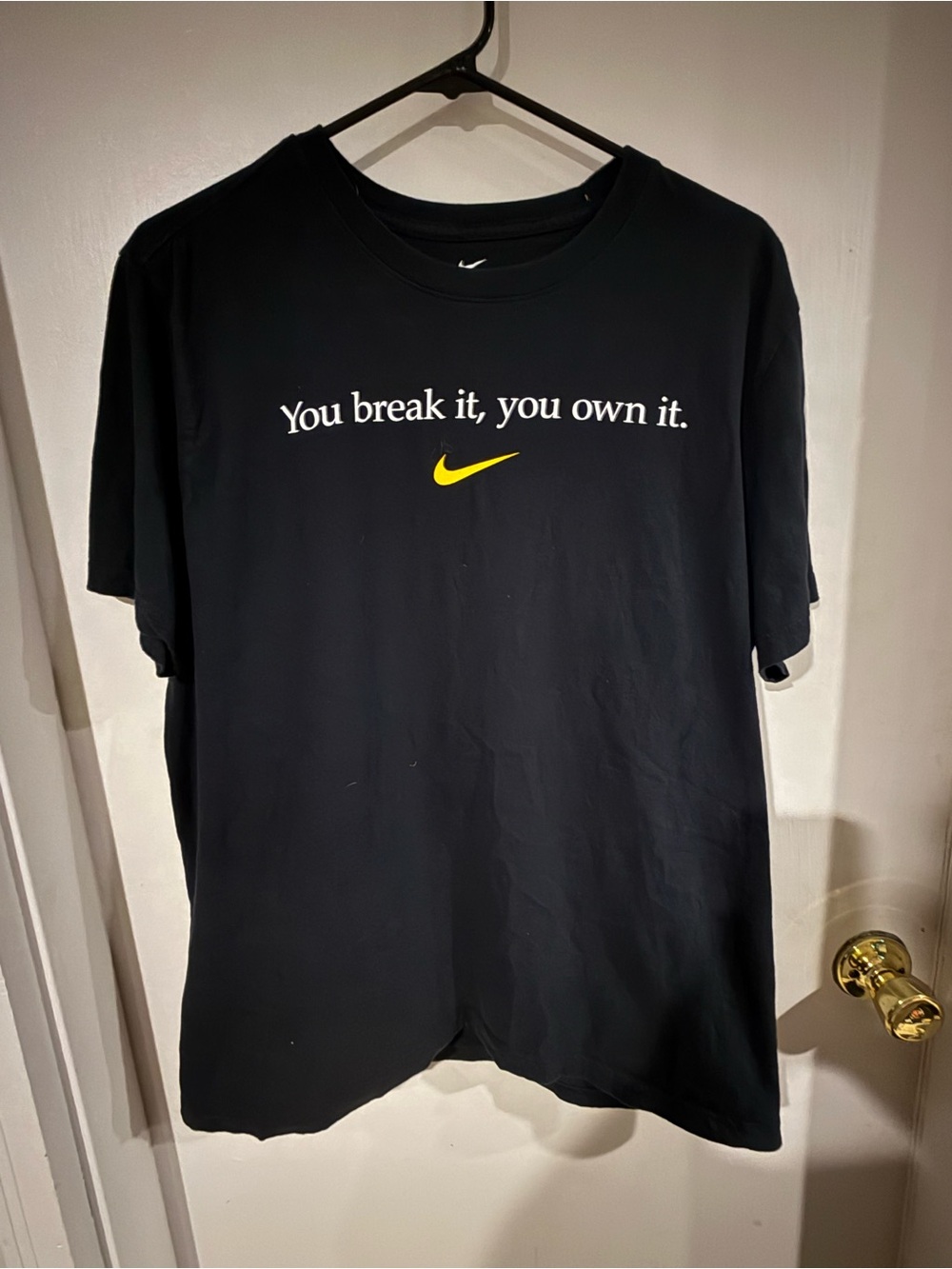 Nike Black Short-Sleeve Caitlin Clark 22 Tee with Yellow Swoosh and White Slogan